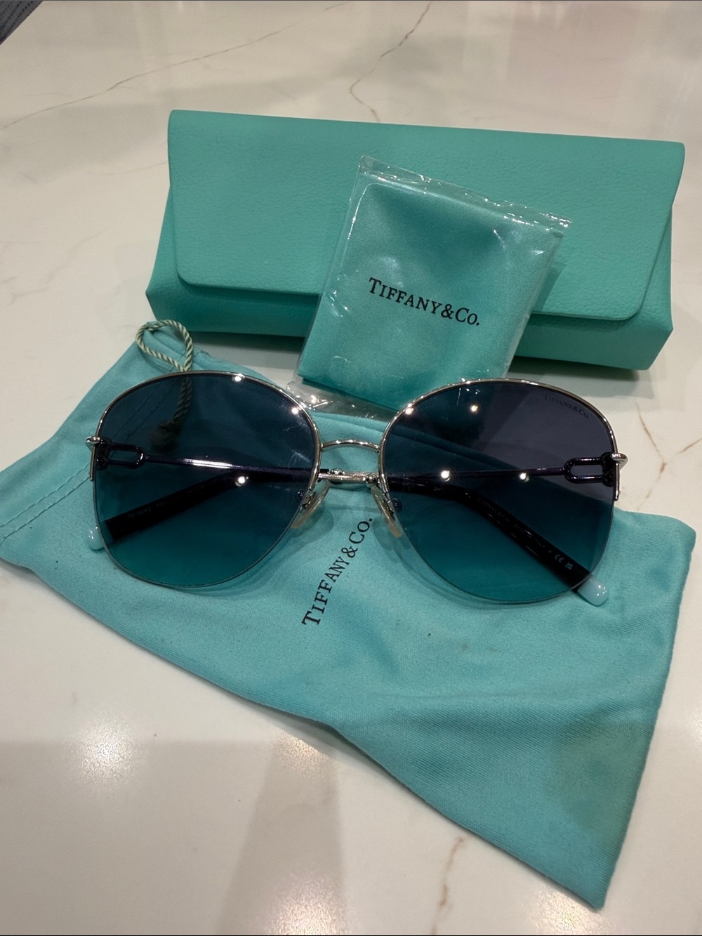 Tiffany & Co. Women's Round Silver Frame Sunglasses with Gradient Blue Lenses